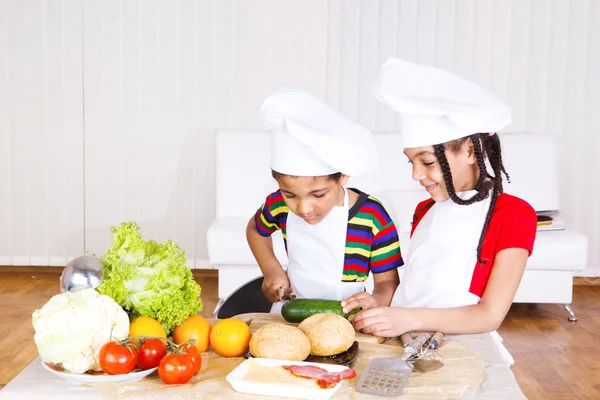 Boy and girl cooking — Stock Photo, Image