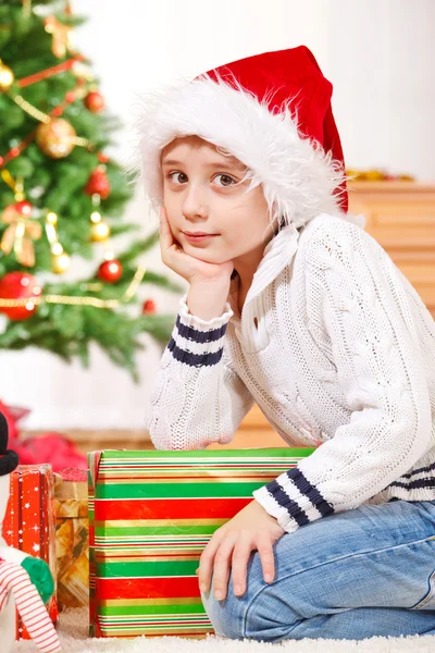 Kid beside presents Stock Picture