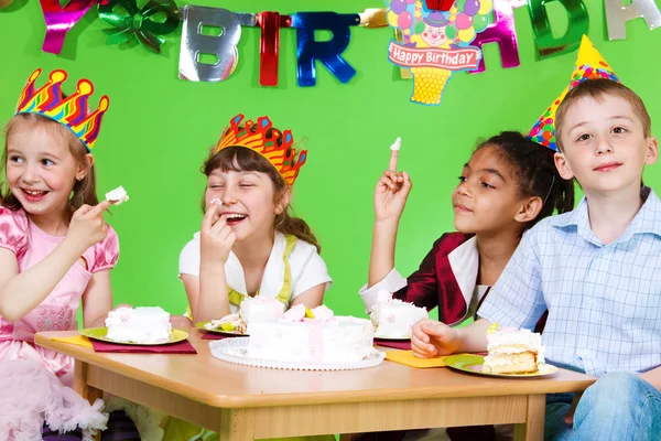 Kids eating cake Royalty Free Stock Images