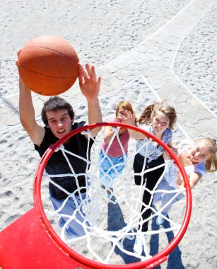 Teenagers playing basketball clipart