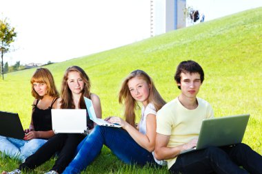 Teens with laptops clipart