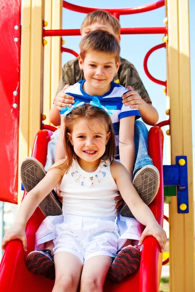 Children on the chute — Stock Photo, Image