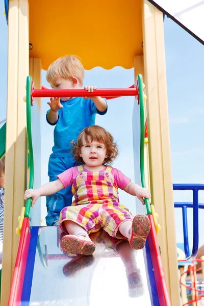Toddlers on a chute — Stock Photo, Image