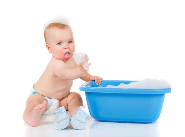 Baby beside blue basin — Stock Photo, Image