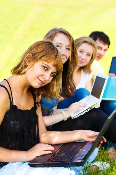 Teenagers with laptops — Stock Photo, Image