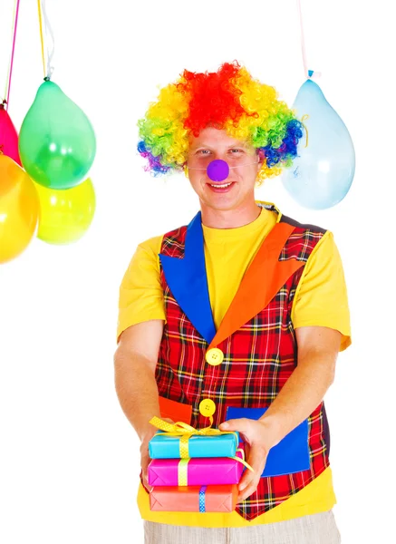 Smiling clown with presents — Stock Photo, Image