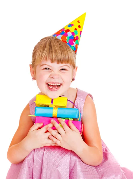 Little girl with presents and party hat — Stock Photo, Image