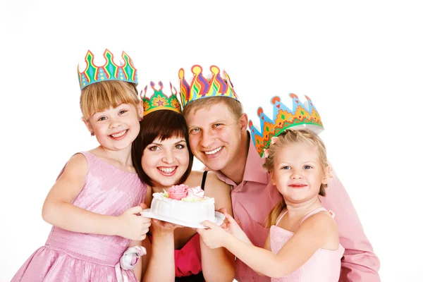 Parents and daughters holding a cake — Stock Photo, Image