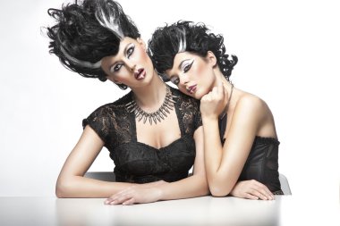 Two sexy women wearning wigs clipart