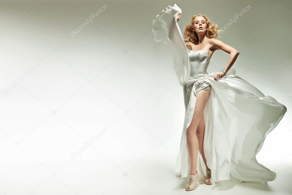 Blonde beauty posing on white background