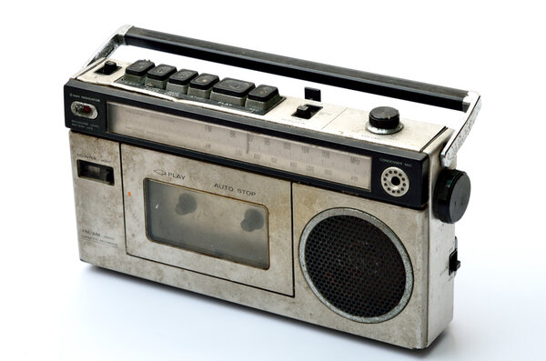 Retro radio and tape player on white background