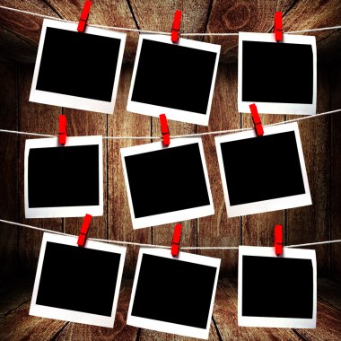 Polaroid frames hanging on rope clipart