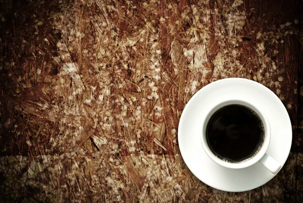 Coffee cup on grunge wood table — Stock Photo, Image