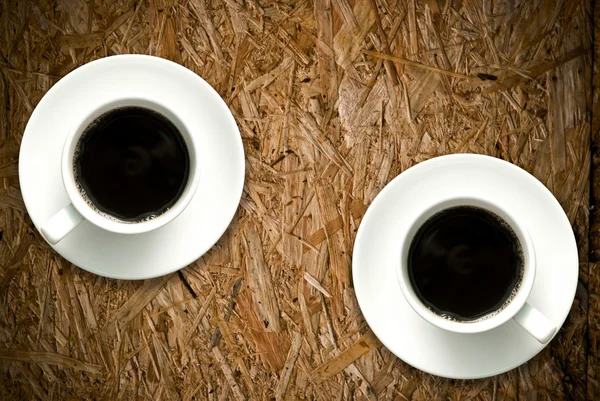Coffee cup on grunge wood table — Stock Photo, Image
