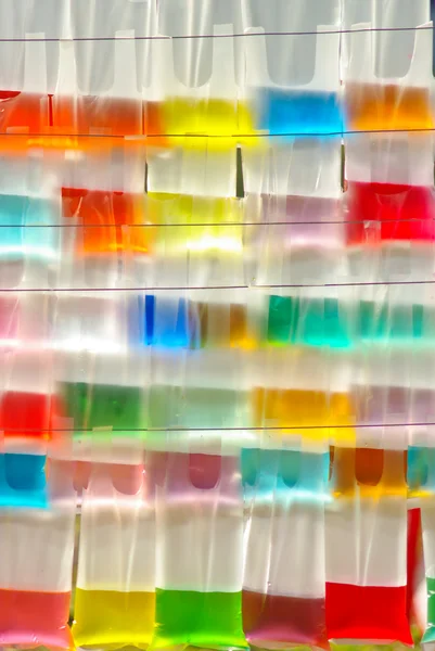 Plastik torba ile renkli su — Stok fotoğraf