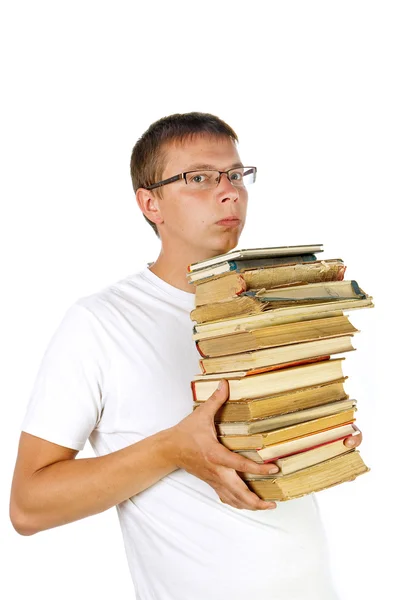 Jonge man met stapel boeken — Stockfoto