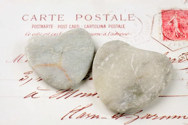 Stone hearts with postcard — Stock Photo, Image
