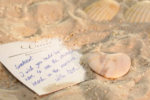 Postcard in the sand — Stock Photo, Image