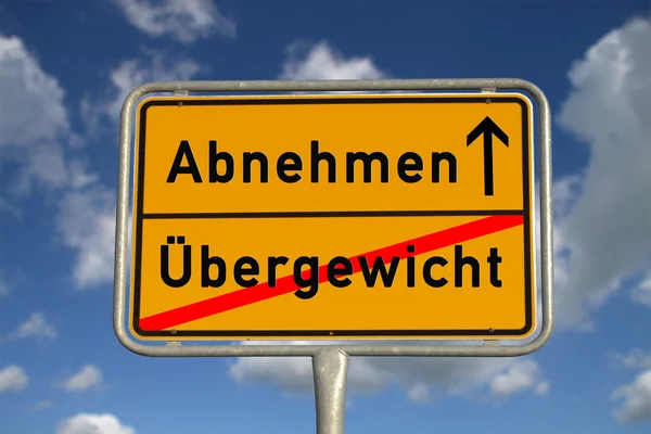 Znak drogowy niemiecki schudnąć i nadwaga — Zdjęcie stockowe