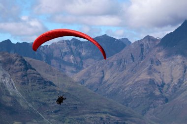 Paraglider in the mountains clipart