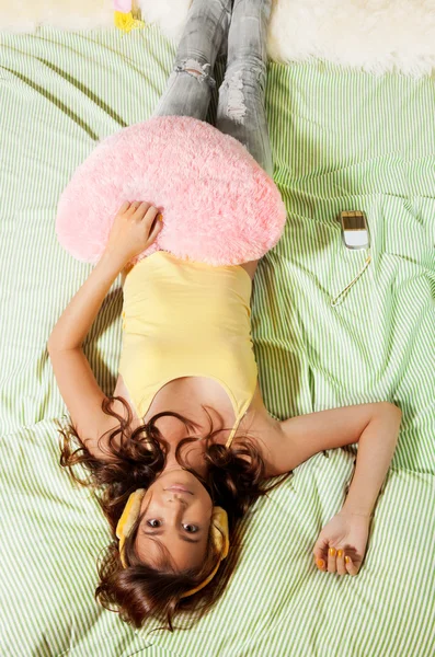 Happy teenage girl in her bed — Stock Photo, Image