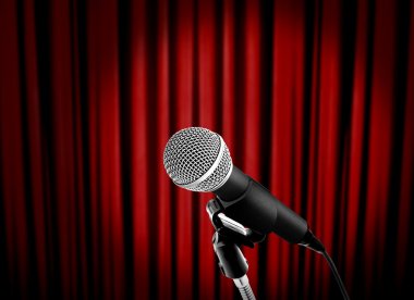 Microphone on stage with red curtain clipart