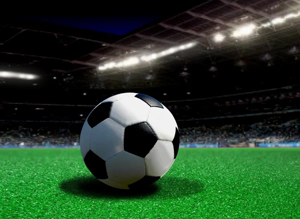 Soccer ball in stadium at night — Stock Photo, Image