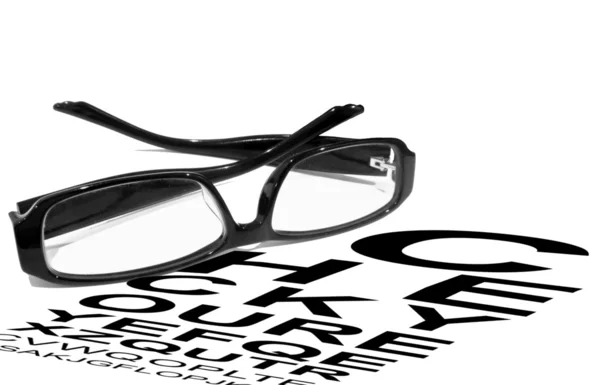 Reading glasses with eye chart — Stock Photo, Image