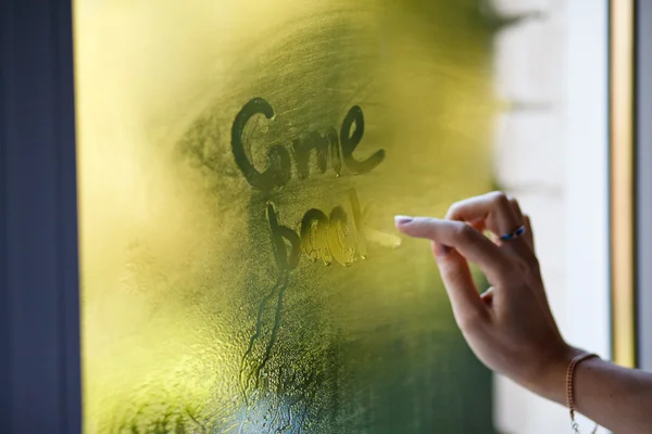 A hand writing on window — Stock Photo, Image