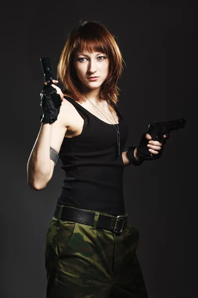 Woman with Gun on dark — Stock Photo, Image