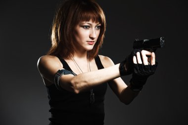 Sexy woman holding gun clipart