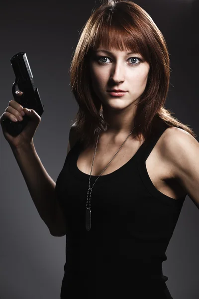 Woman holding gun — Stock Photo, Image