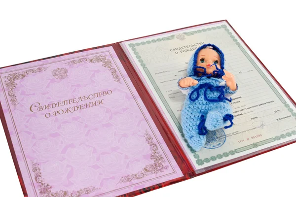 Birth certificate and doll — Stock Photo, Image