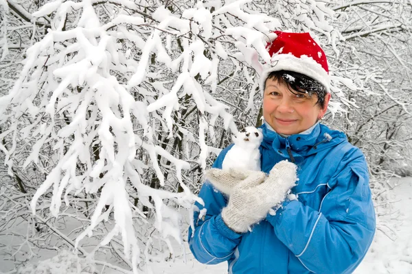 Woman with snowball — Stock Photo, Image