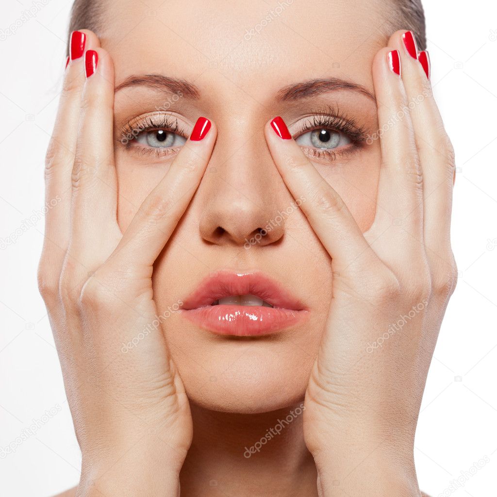 Woman with hands on face