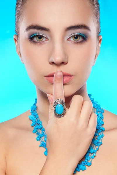 Brunette with necklace and ring on finger — Stock Photo, Image