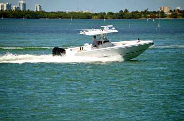 Outboard Engine Powered Fishing Boat clipart