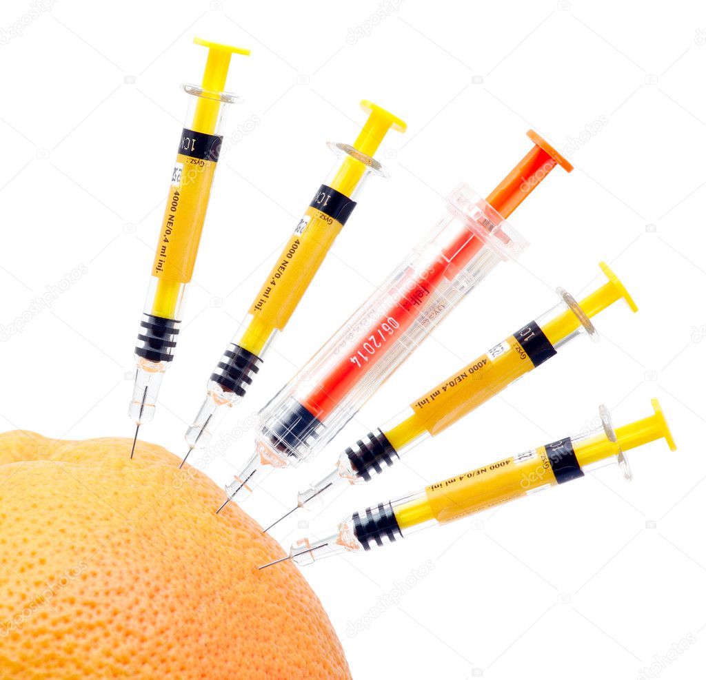 Syringes and orange.