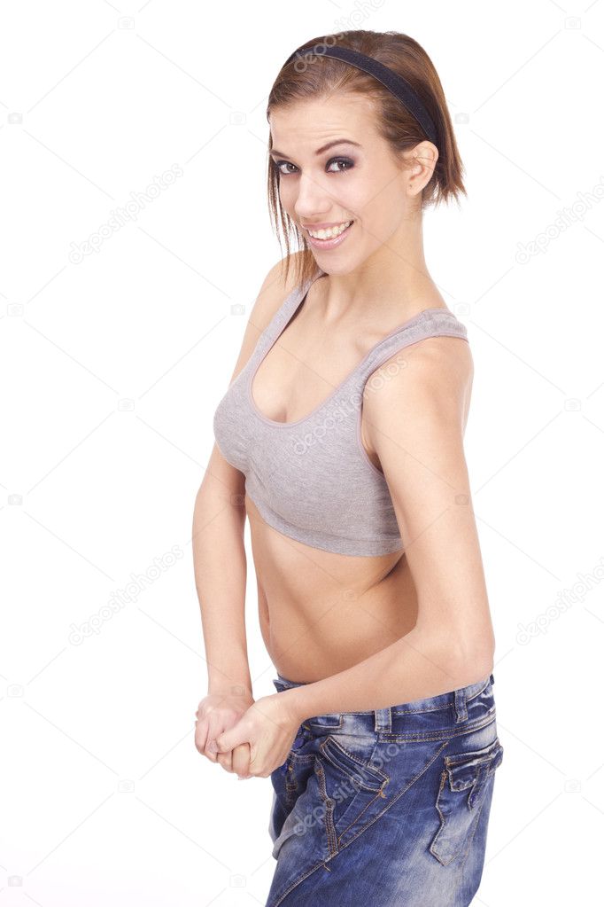 Thin Woman Flexing Her Arm Muscle - Horizontal by Stocksy