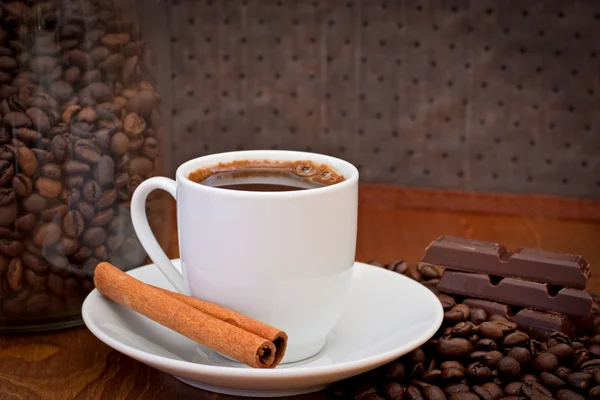 Cup of coffee, cinnamon and chocolate — Stock Photo, Image