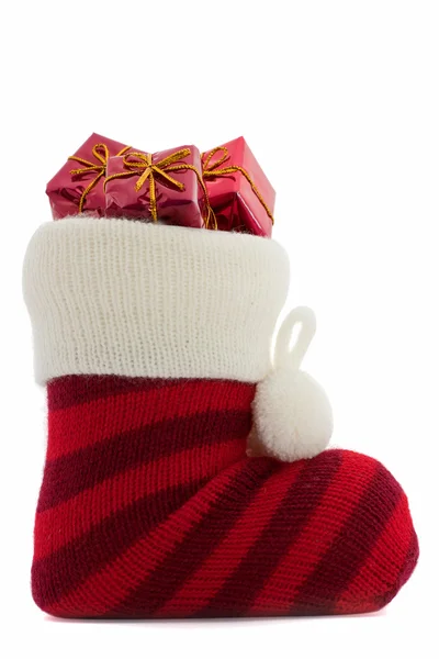 圣诞袜与呈现在白色背景 免版税图库照片