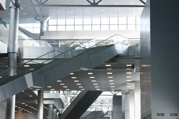 Modern business center interior with escalators — Stock Photo, Image