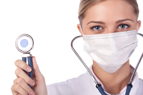 Portret van een meisje arts in een masker. phonendoscope — Stockfoto