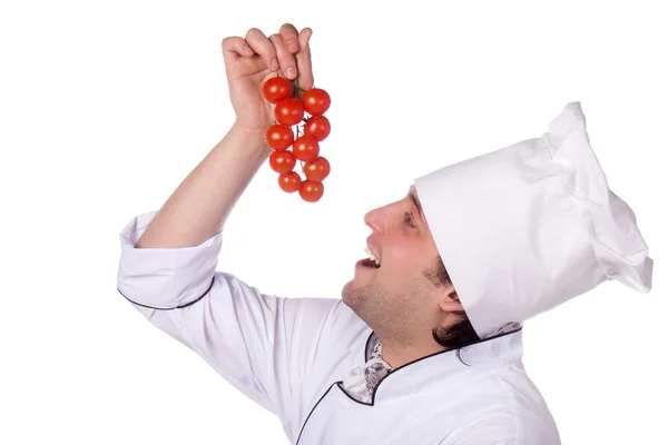 Cook man has cherry tomatoes — Stock Photo, Image