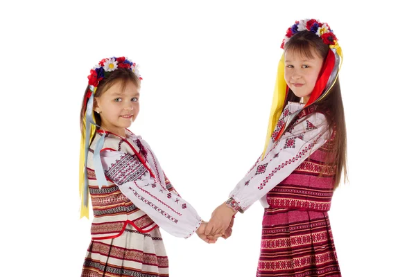Un bambino, due ragazze in un abito luminoso . — Foto Stock