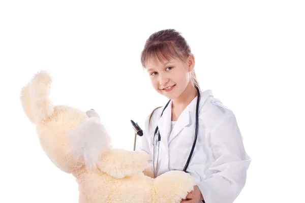 Meisje, een arts, de kind, konijn speelgoed — Stockfoto