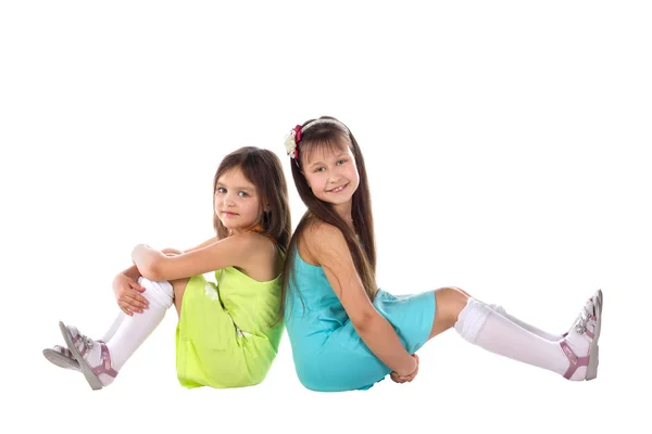 Un niño, dos niñas sentadas allí . Imagen De Stock
