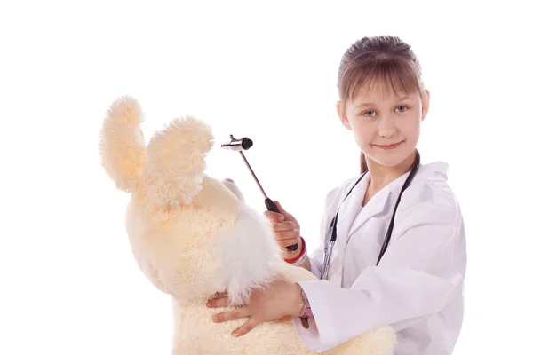Menina, um médico, a criança, brinquedo de coelho Imagem De Stock