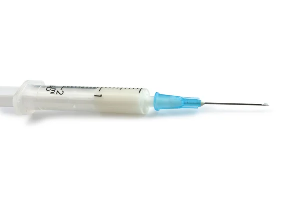 Syringe with droplet Royalty Free Stock Photos