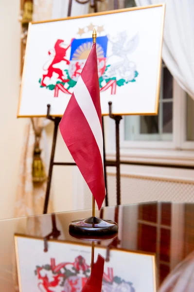 stock image The national flag and Coat of arms of Latvia